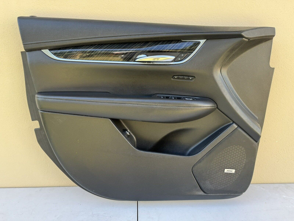 Left driver side front door trim panel with master window switch