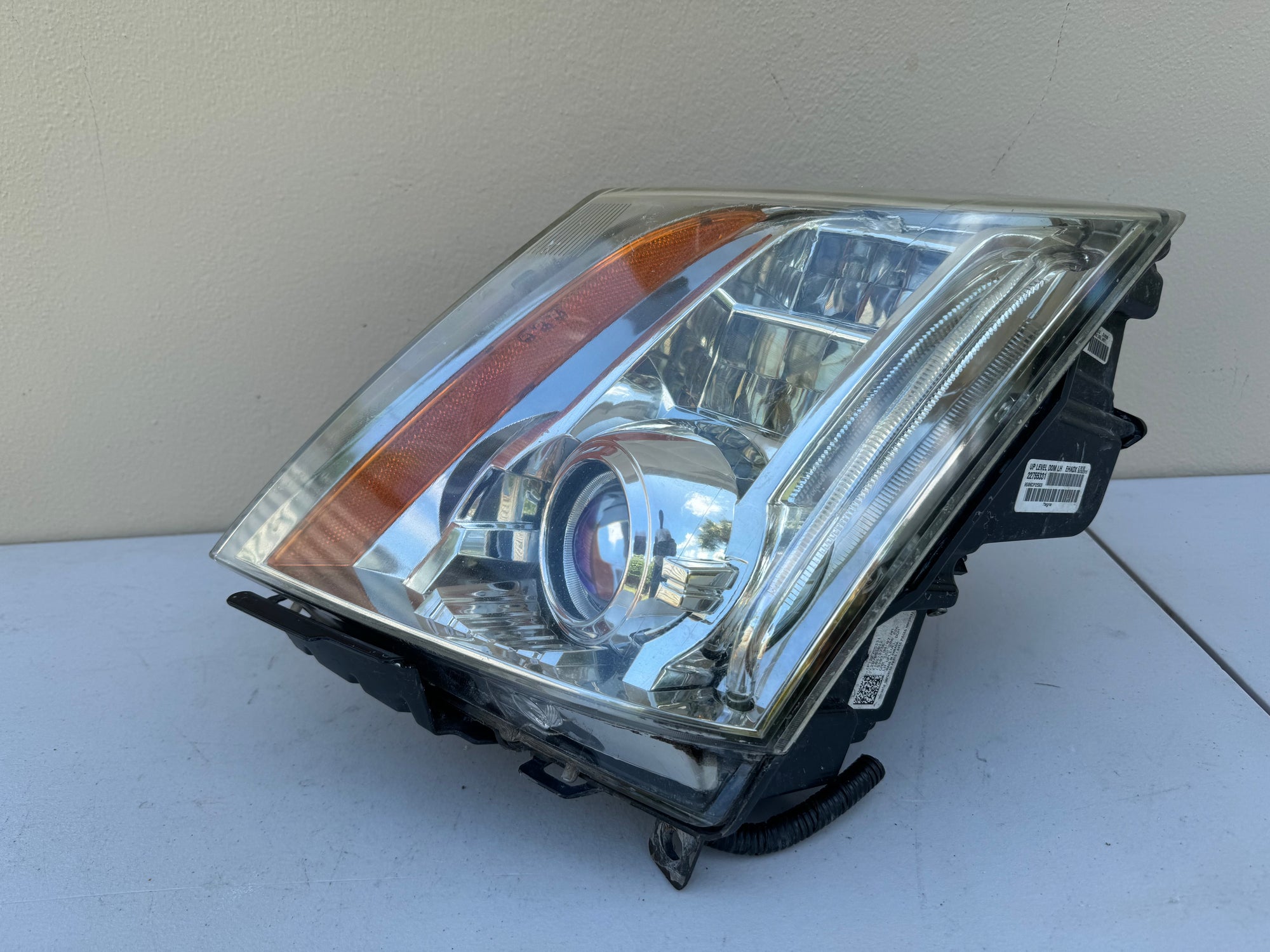 2008-2014 Cadillac CTS Left LH Xenon HID Headlight OEM on a white surface with a beige background
