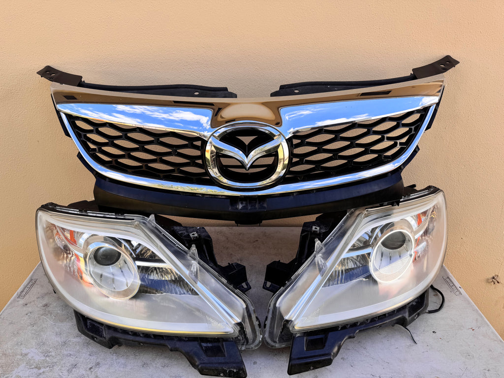 2010-2012 Mazda CX-9 Xenon HID Headlight Assembly PAIR w/ Upper Grille OEM