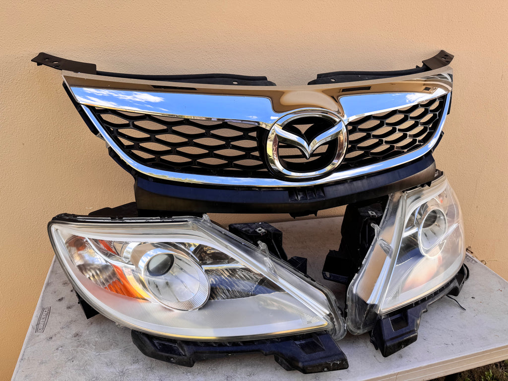 2010-2012 Mazda CX-9 Xenon HID Headlight Assembly PAIR w/ Upper Grille OEM